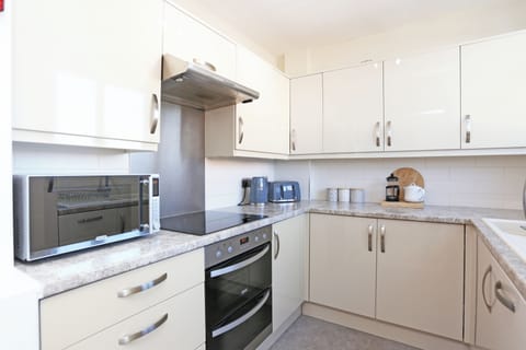 Fully equipped kitchen area on first floor