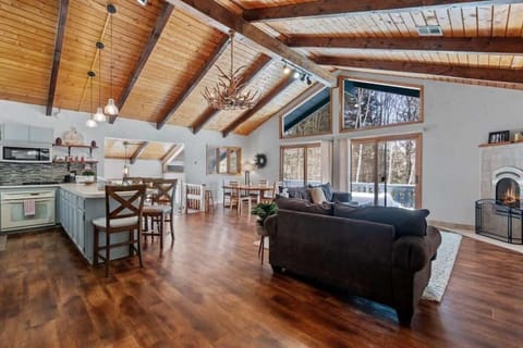 Gather 'round the fire! Our spacious living and kitchen area is perfect for cozy evenings together