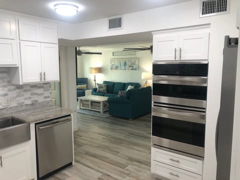 View of the Family/Living Room from the Kitchen. Convection Oven and Microwave. 