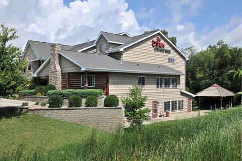 Pull up easily to a lodge-style exterior surrounded by greenery.