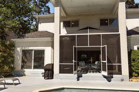 Exit the primary bedroom to the pool deck with sliding doors