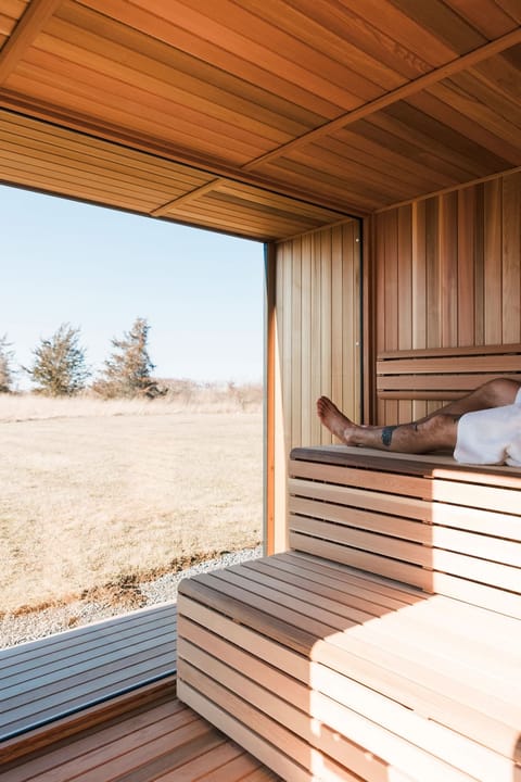 Enjoy the outdoor sauna, boasting field views of the idyllic Prince Edward County landscape.