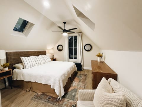 King sized bed with blackout drapes. (TV included, see next photo.)