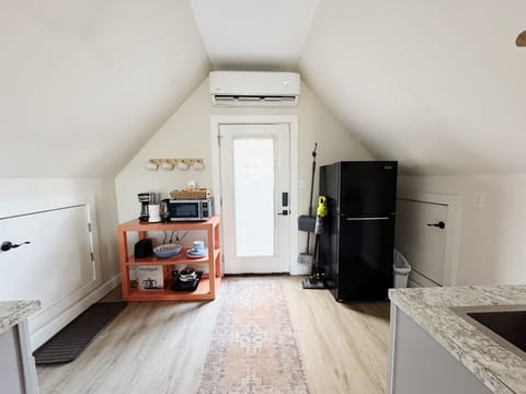 Fully stocked kitchen with countertop cooktop, crock pot, full size fridge, etc.
