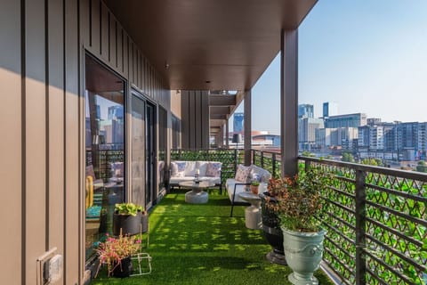 Unwind in your private oasis with lush greenery and city views