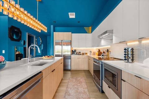 Full kitchen with stove/oven, microwave, full-sized refrigerator, and dishwasher