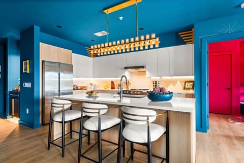 Open kitchen with comfortable bar stools, stocked with all the essentials