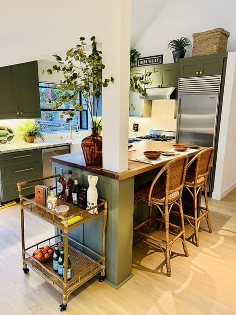 Kitchen, and island looking out to outdoor living area