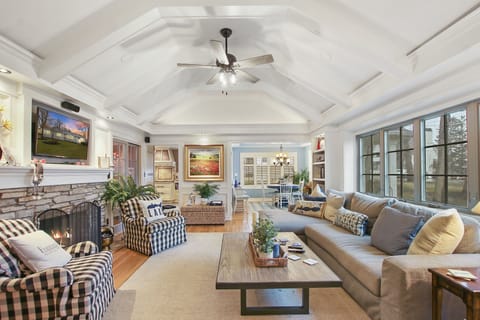 Living room with TV and fireplace
