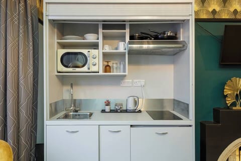 Kitchenette: Fully equipped for culinary adventures with sleek appliances and stylish decor!
