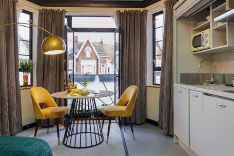 Dining Nook: Brighten up your mornings with views and stylish seating for two!