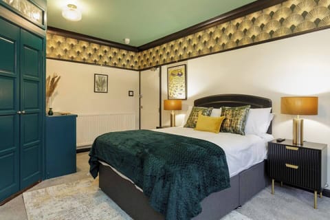 Bedroom Retreat: Unwind in this stylish room with chic decor and plush bedding for ultimate relaxation!