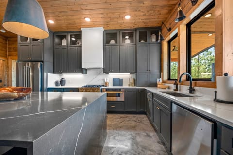 Chic Culinary Space - Where modern amenities meet sleek design, perfect for cooking up new memories.