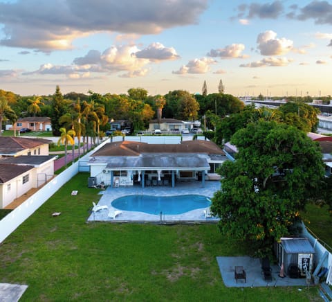 Arial view of large yard, pool and water