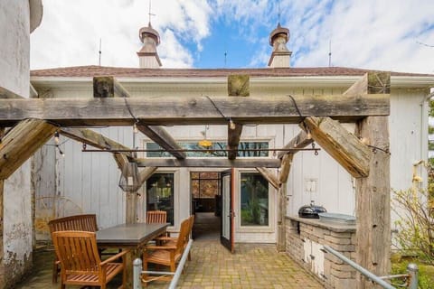 The Patio, complete with custom concrete dining table and 22" Weber charcoal grill.