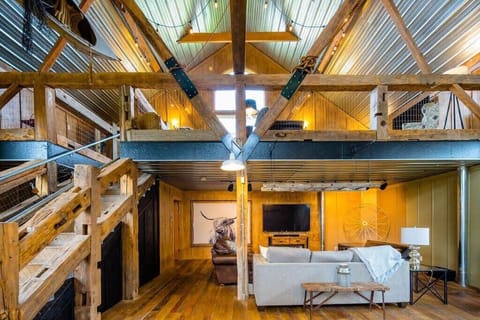 The Lower Lounge, complete with 75" smart TV and 3 comfortable couches.