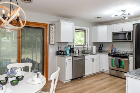 A well-stocked kitchen with pots, pans, plates, and silverware provides everything you need for a home-cooked feast.