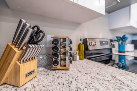Our kitchen is outfitted with sharp knives and an organized spice rack, catering to all your culinary needs with precision and flavor.