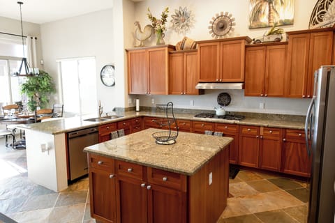 Custom tile work throughout the home. Huge Kitchen island 