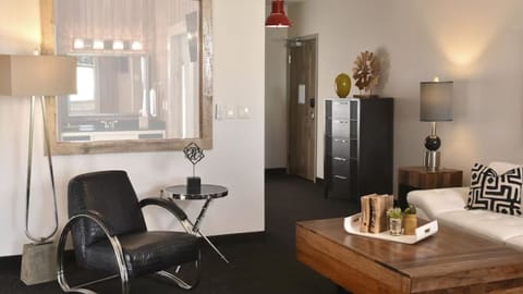 Relax with modern art, plush seating, and calming tones.