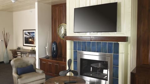Settle in by the fireplace, then catch up at the desk.