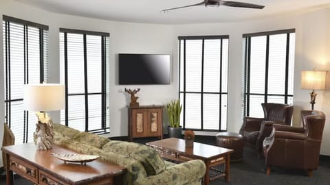 Gather in sunlit seating with oversized windows and relaxed vibes.