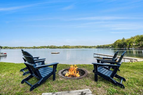 Private firepit at the lake with a floating raft