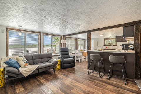Living room, bar and kitchen view