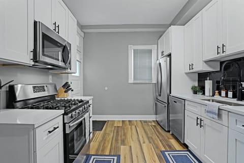 Cook up a storm in this stylish kitchen with sleek appliances and bright ambiance!