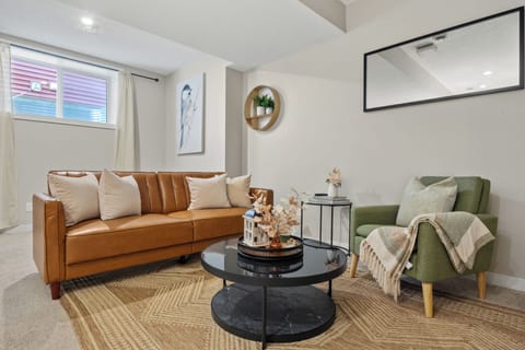 Cozy living area with modern décor and comfortable seating.