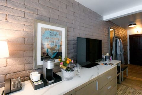 Modern living space with chic brick accent wall and warm lighting