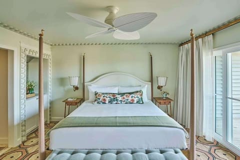 Wake to soft ocean breezes drifting through sunlit shutters and coastal charm in every detail.