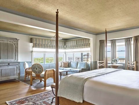 Wake to golden light and open skies in a tranquil room where coastal elegance meets complete comfort.