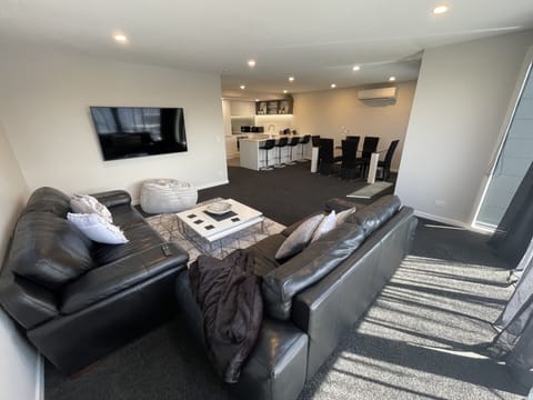 lounge area looking into dining area and kitchen 