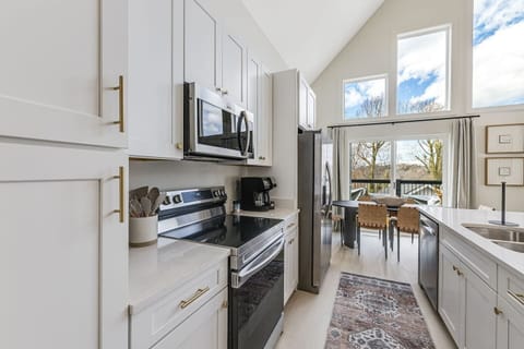 Plenty of space for moving in the kitchen, with the stove, sink, and refrigerator all next to each other!