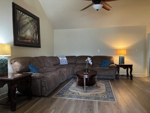 Large main living room with lots of seating for tv viewing