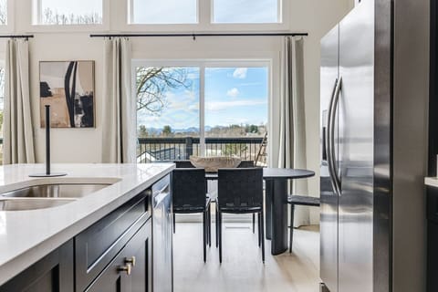 Plenty of space for moving in the kitchen, with the stove, sink, and refrigerator all next to each other!