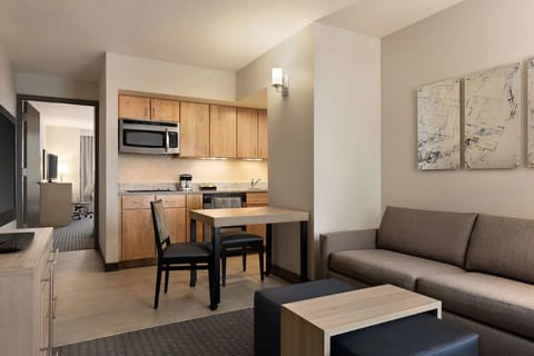 Enjoy easy meals in the kitchenette with comfortable lounge nearby.