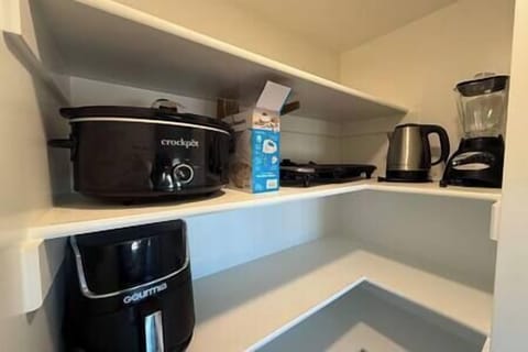 Walk in pantry with blender, hot water maker, electric grill, electric mixer, crockpot and air fryer