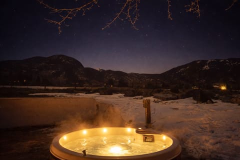 Outdoor hot tub on the brick patio under the stars