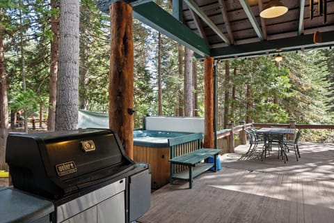 Large covered patio with BBQ and hot tub