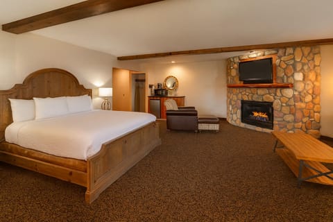 Unwind beside the stone fireplace in your king suite.