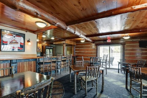 Sip and socialize in the rustic bar with lodge atmosphere.