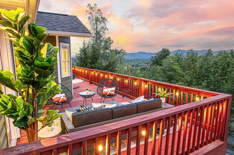 Experience the magic of twilight from above, with the property glowing under the evening sky.