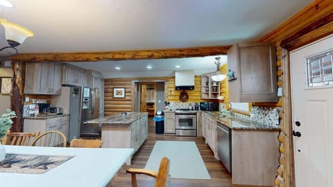 Full size kitchen with appliances, pots and pans, dishes, utensils, and basic cooking essentials.