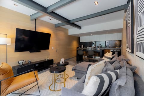 Fully furnished living room with TV.


