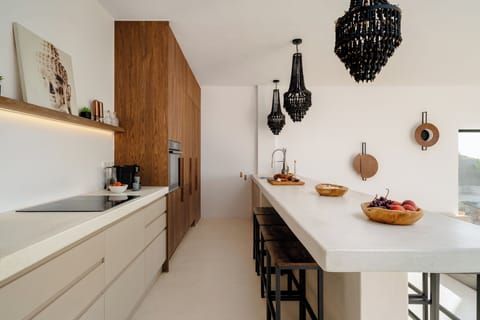 Very long kitchen island with space for dining for 8-10 persons