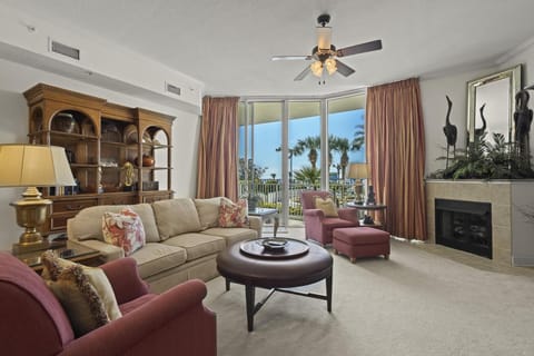 Living Area - The open living area features floor to ceiling 11ft. sliding glass doors, which lead out to a spacious balcony overlooking the Pool.