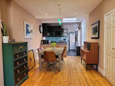 Open plan kitchen dining area that seats 6. Great table for dining and  some board game action provided.
There's a poker chip set with cards, chess, Bandu, Carrom to keep you entertained.