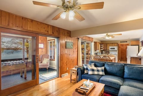 Living room with doorway to the sunporch overlooking the lake.